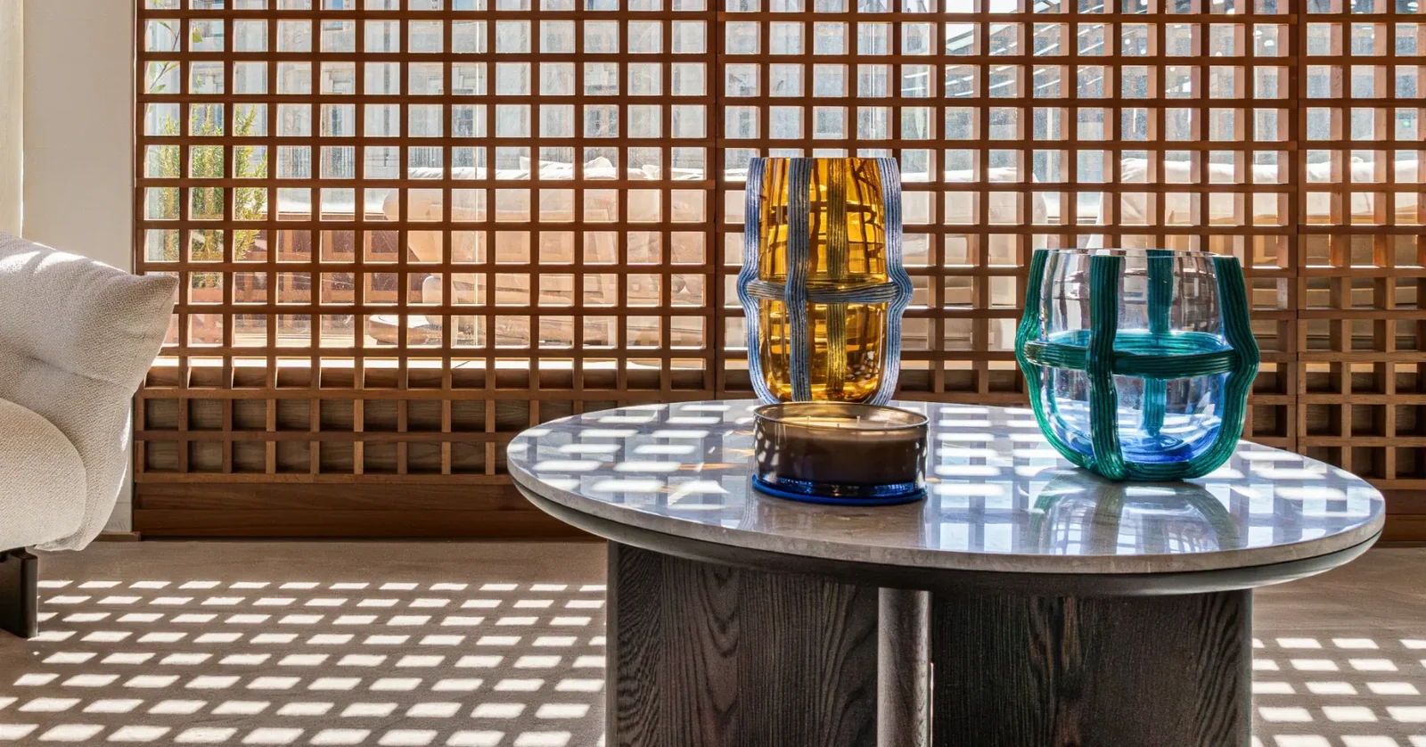 Casa Lamar showroom — colorful glassware by the wooden lattice