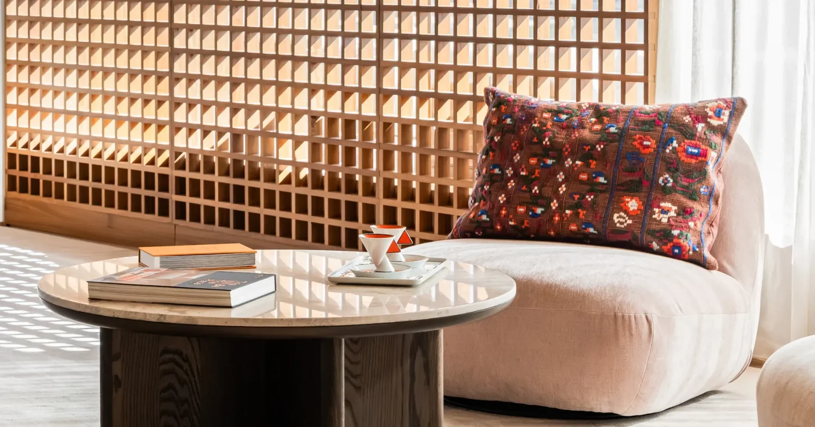 Casa Lamar showroom — lounge chair with a patterned cushion