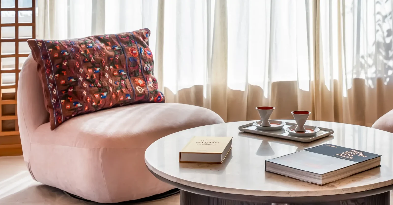 Casa Lamar showroom — reading lounge and coffee table